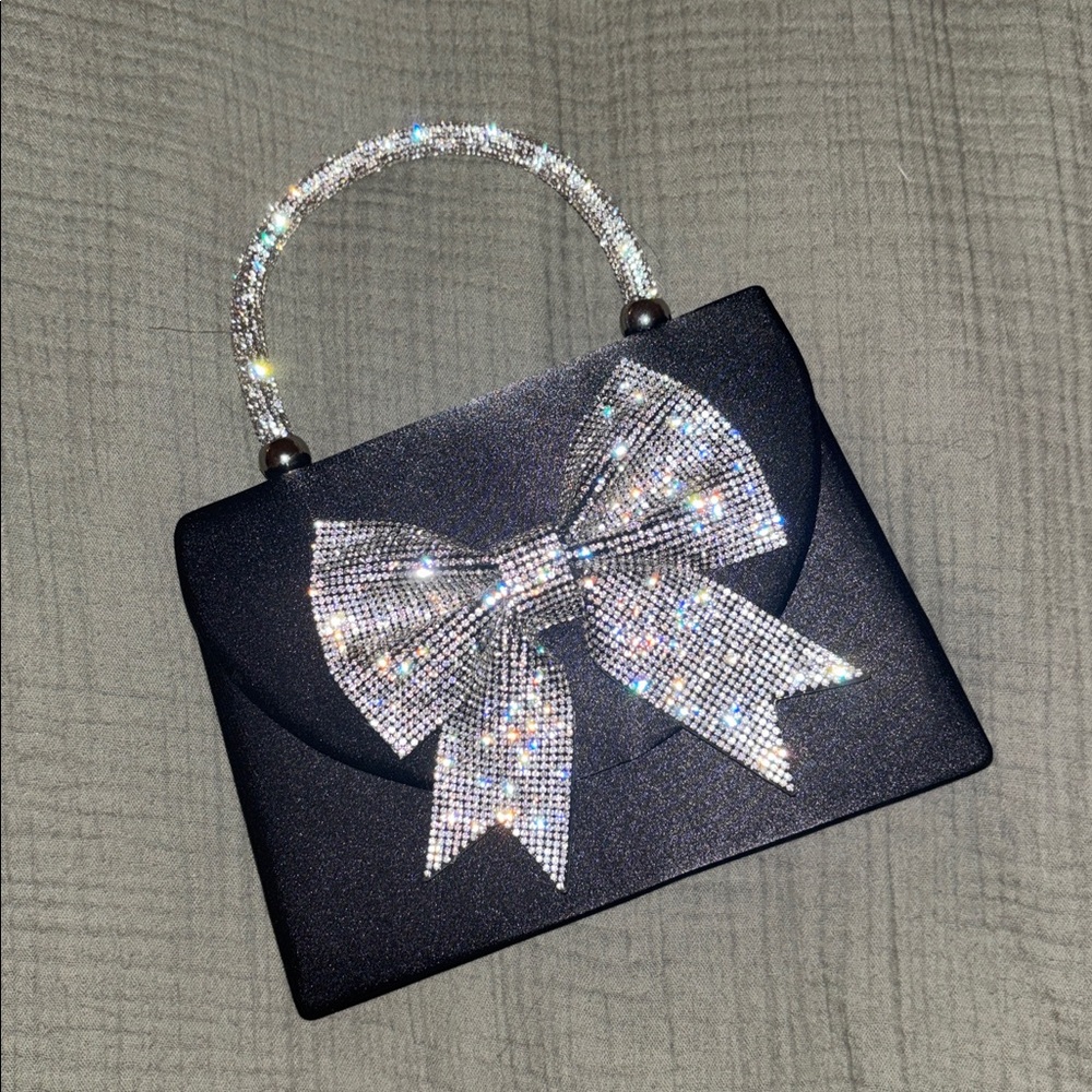 Small purse with silvier hand placed rhinestones